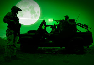 Special operations forces in a firefight during a night operation.