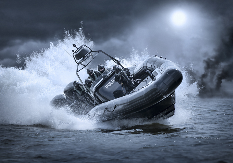 A boarding team of a police special unit on a RIGID INFLATABLE BOAT.