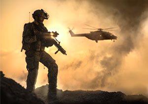 A combat ready german future soldier with a helicopter in the background.