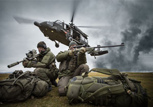 Two special operations forces scout snipers are picked up by a blackhawk helicopter.