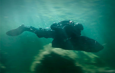 A Special Operations Forces combat swimmer with a diver propulsion vehicle.