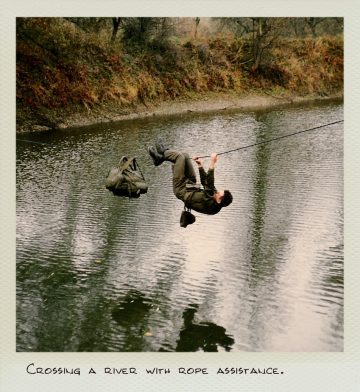 Crossing a river with rope assistance.