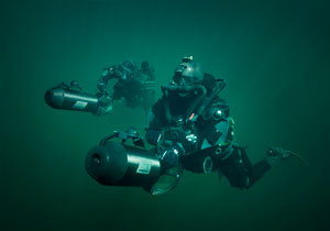 Two Special Operations Forces combat diver with diver propulsion vehicle.